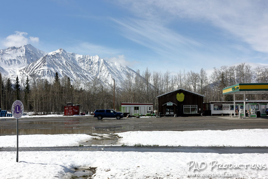 Gas station with wet gravel in Haines Junction, Yukon Territory