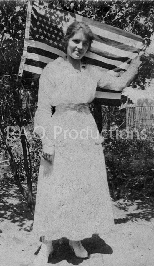 Vintage photo of woman in front of U.S. flag