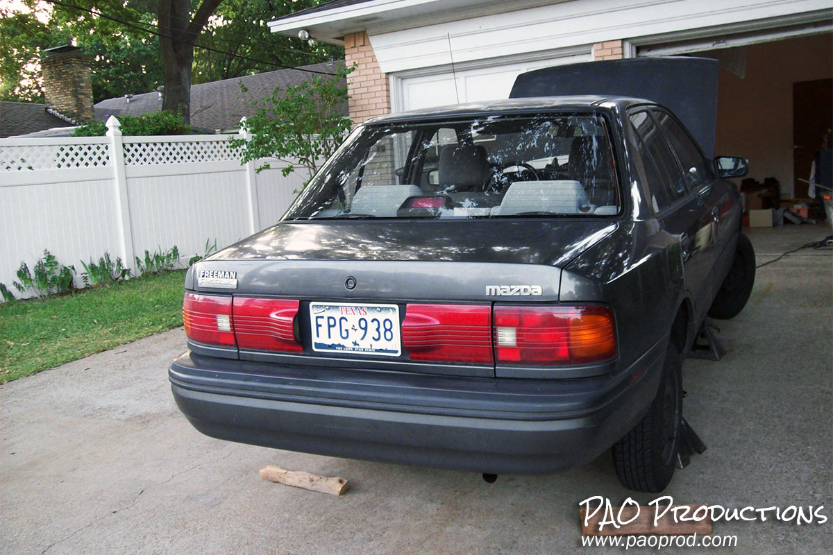 The car being worked on at my uncle's house in July 2008