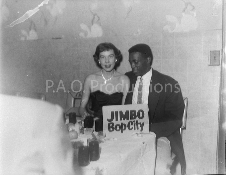 Interracial couple at Jimbo's Bop City, likely 1950s