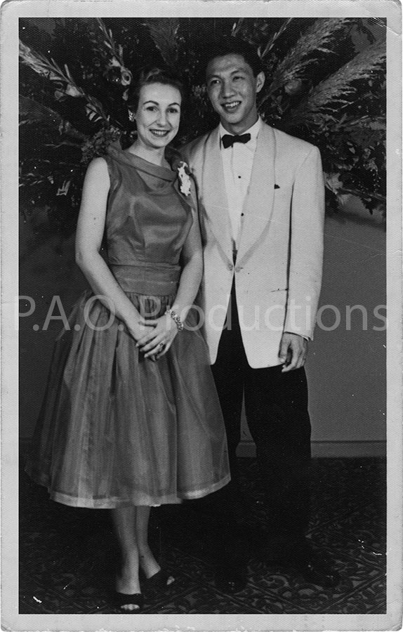 1950s interracial couple at social event