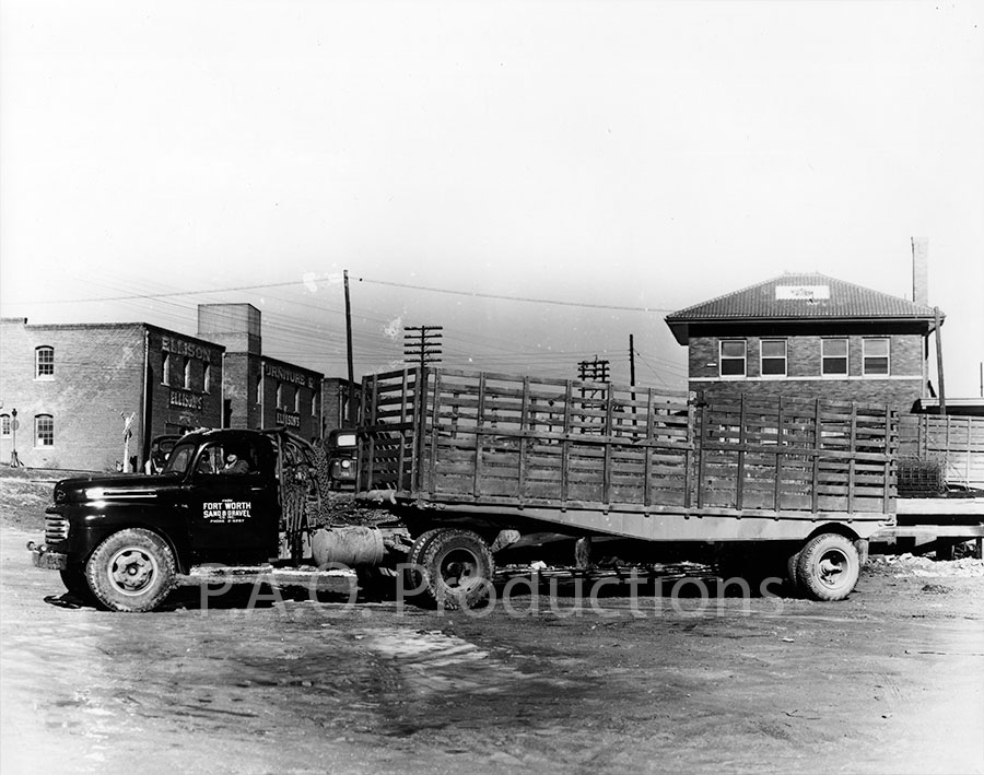 Gravel truck and Ellison Furniture & Carpet Company, circa 1950s