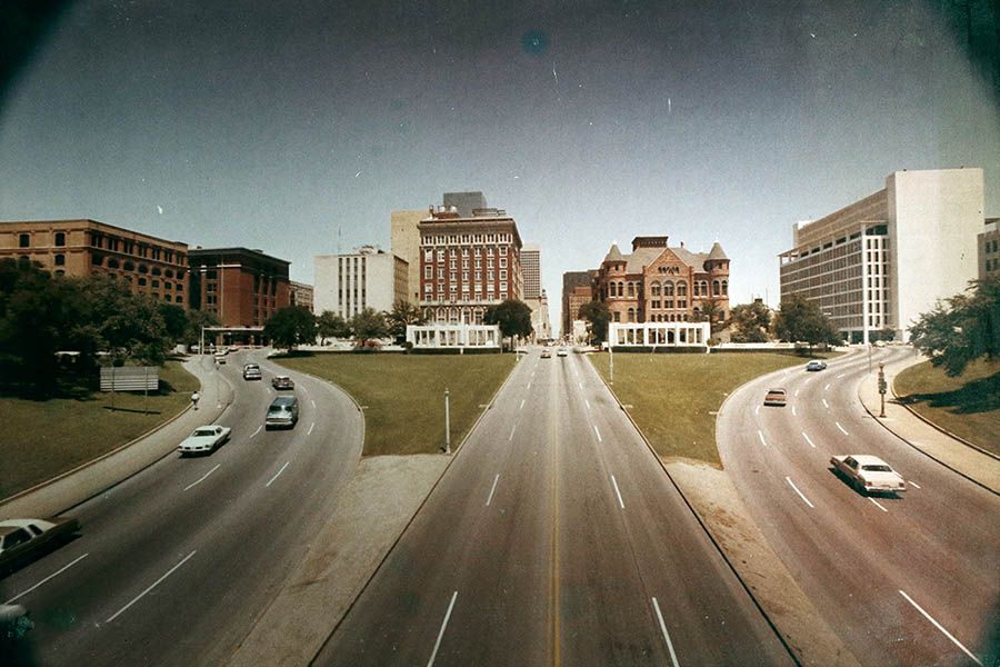 Facing east toward Dealey Plaza from the Amtrak line bridge (now DART rail), 1970s